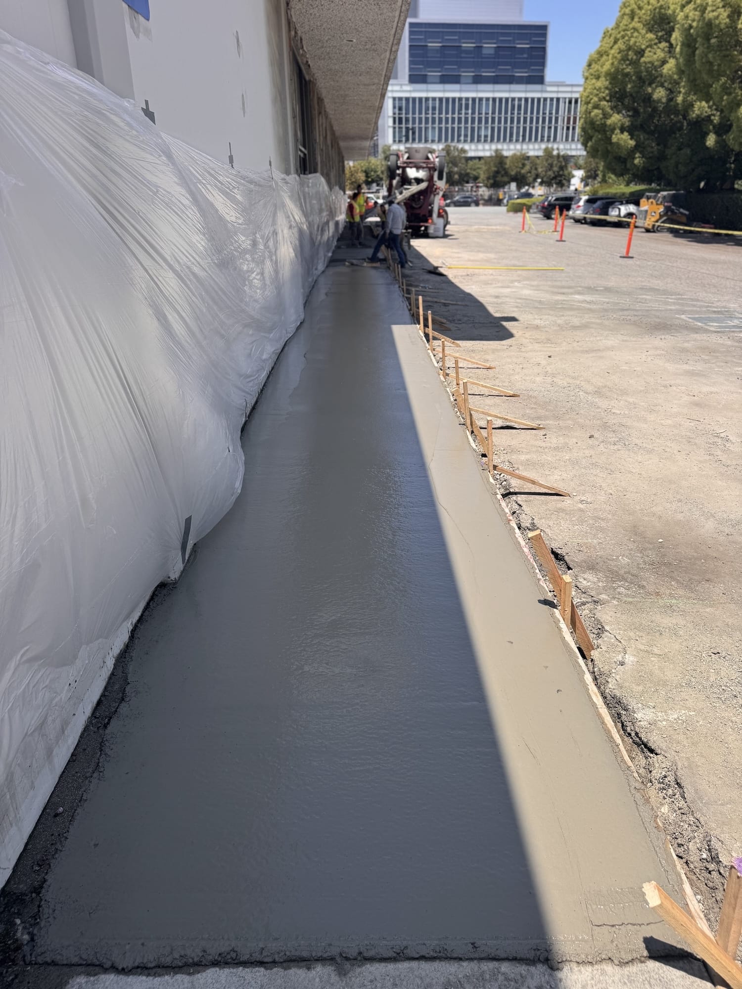 concrete entrance/walkway work or fresh asphalt being rolled