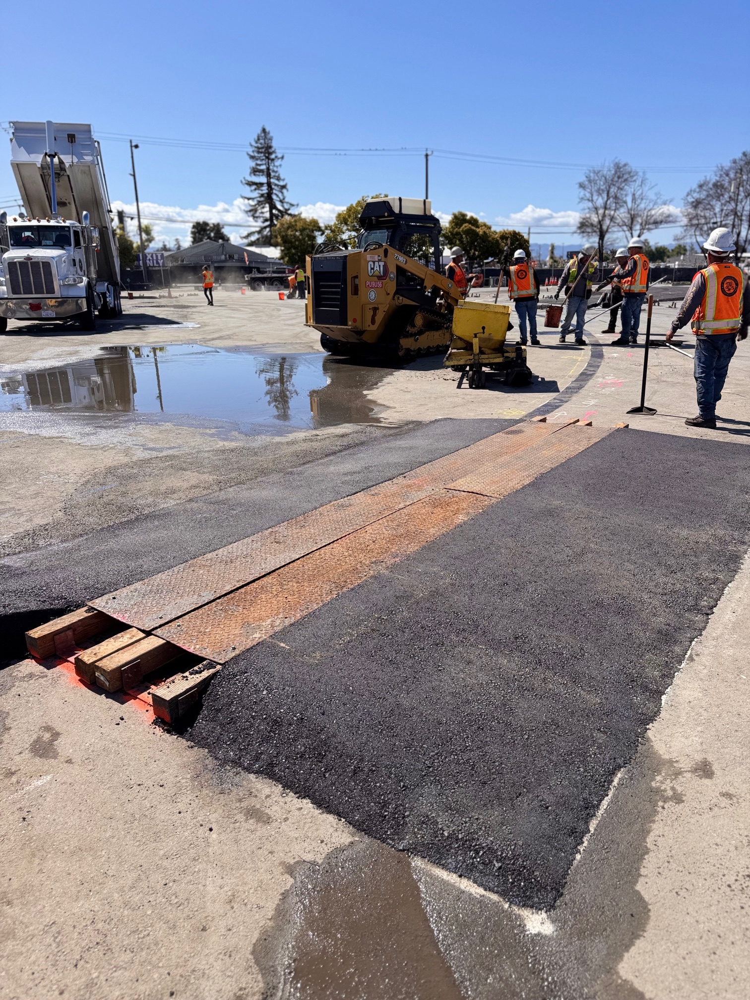 crew paving or rolling the surface
