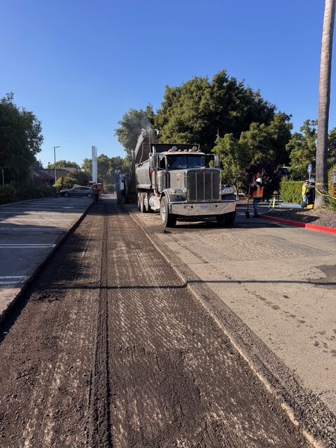 crew and paver laying hot mix asphalt