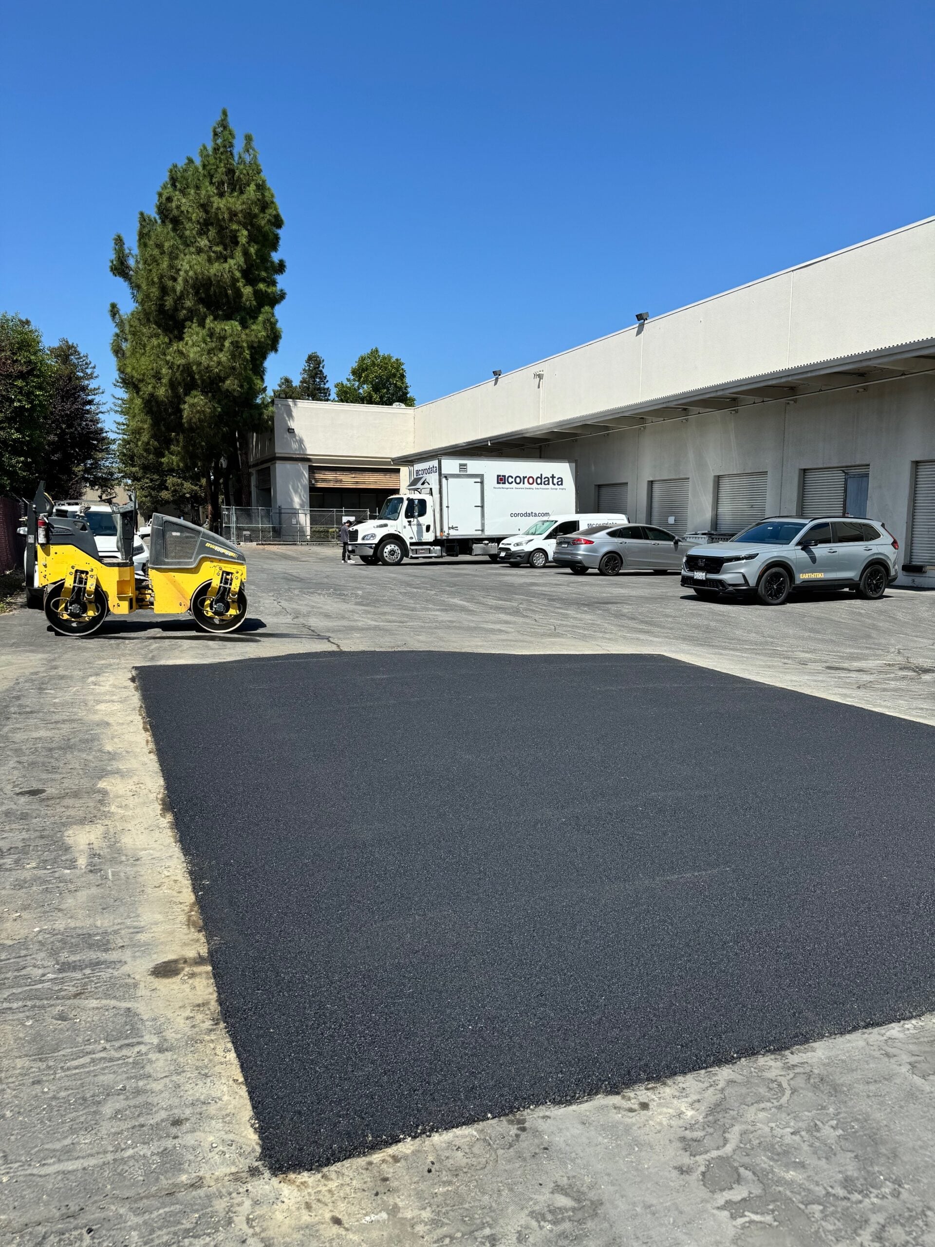 crew and paver laying hot mix asphalt